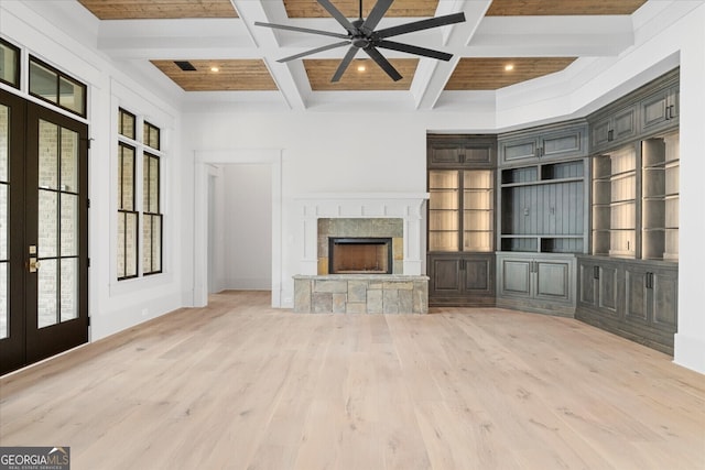 4927 Slaton Dr, Acworth, GA 30101 - unfurnished living room featuring a fireplace with raised hearth, wood finished floors, ceiling fan, coffered ceiling, and beamed ceiling