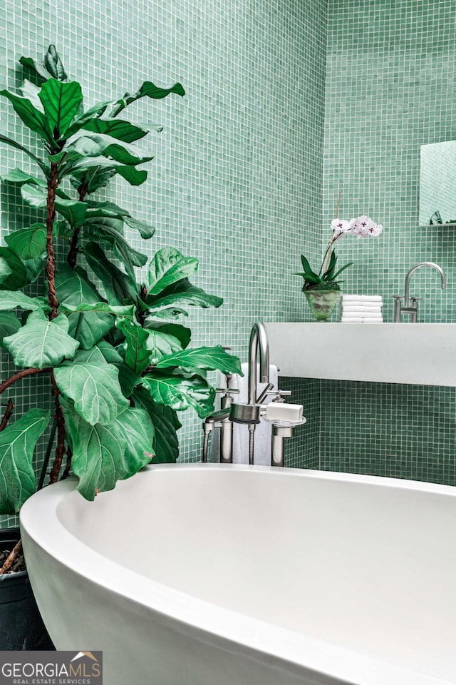 1933 Mclendon Ave NE Unit A, Atlanta, GA 30307 - bathroom featuring a freestanding tub and a sink