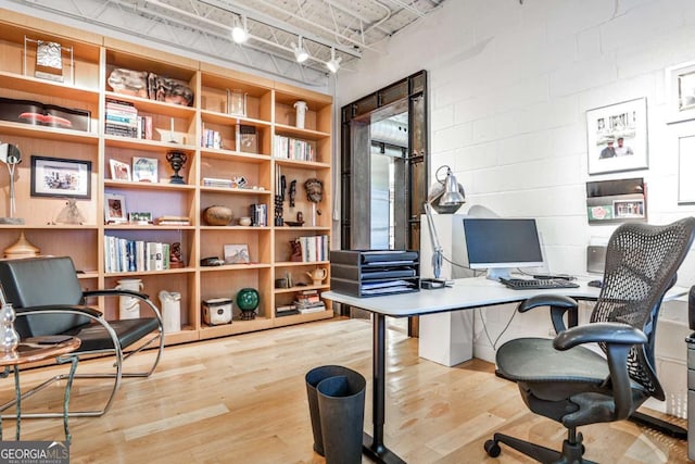 1933 Mclendon Ave NE Unit A, Atlanta, GA 30307 - home office featuring wood finished floors, rail lighting, and concrete block wall