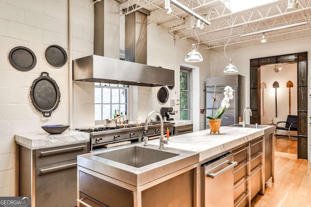 1933 Mclendon Ave NE Unit A, Atlanta, GA 30307 - kitchen featuring island range hood, high end refrigerator, a sink, light wood finished floors, and a kitchen island with sink