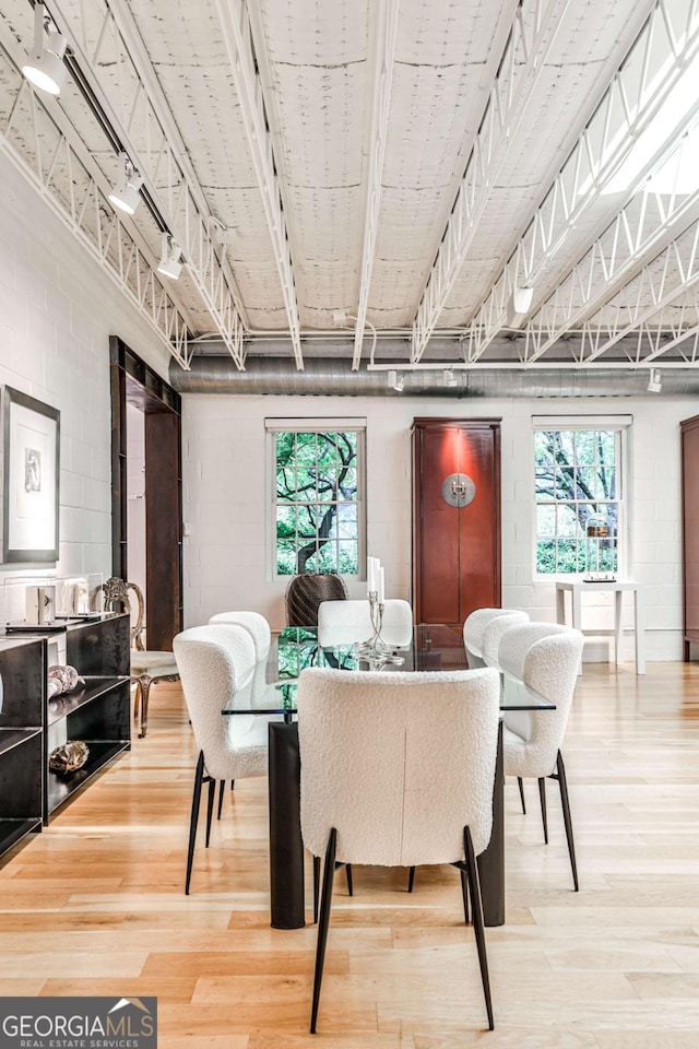 1933 Mclendon Ave NE Unit A, Atlanta, GA 30307 - dining area featuring wood finished floors and concrete block wall