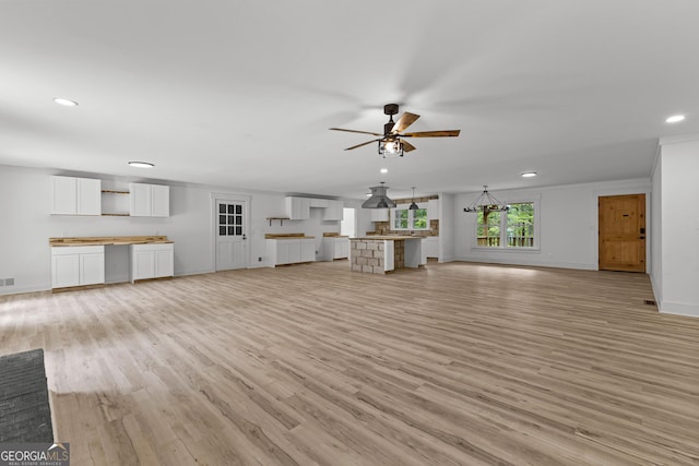 8129 S Giles Rd, Douglasville, GA 30135 - unfurnished living room with recessed lighting, light wood-style flooring, and ceiling fan