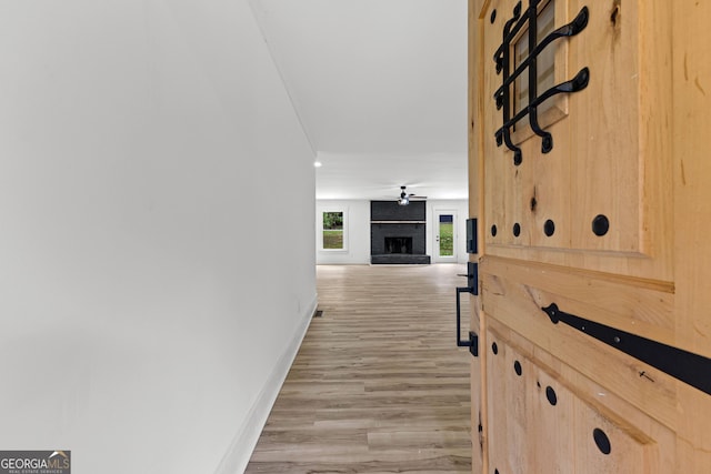 8129 S Giles Rd, Douglasville, GA 30135 - hallway featuring baseboards and light wood-style floors