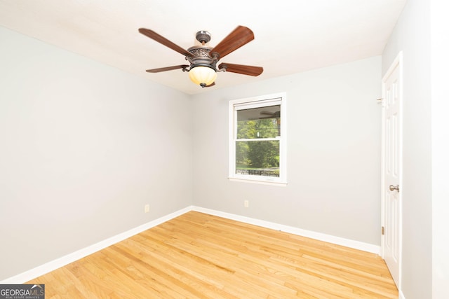 707 29th St, Phenix City, AL 36867 - empty room with baseboards, light wood-style floors, and a ceiling fan