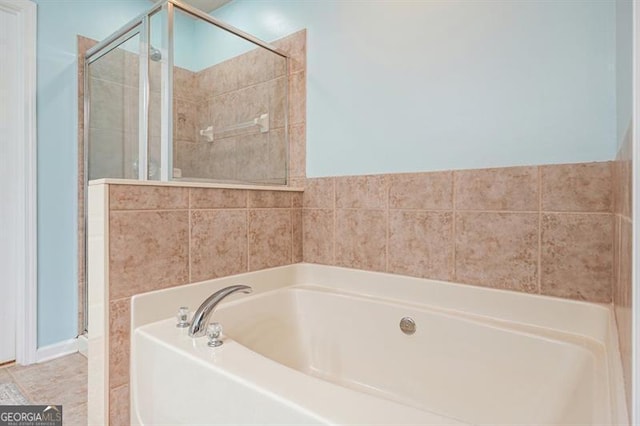 411 Mountain View Ln, Woodstock, GA 30188 - bathroom with a bath and a shower stall