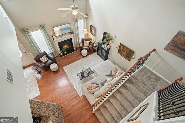 411 Mountain View Ln, Woodstock, GA 30188 - living room with wood finished floors, plenty of natural light, ceiling fan, and a towering ceiling
