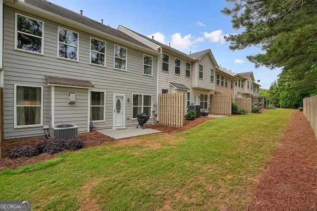 411 Mountain View Ln, Woodstock, GA 30188 - back of property with central air condition unit, a patio, and a residential view