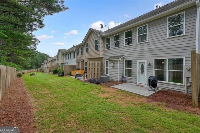 411 Mountain View Ln, Woodstock, GA 30188 - rear view of property with a patio, central air condition unit, and a residential view