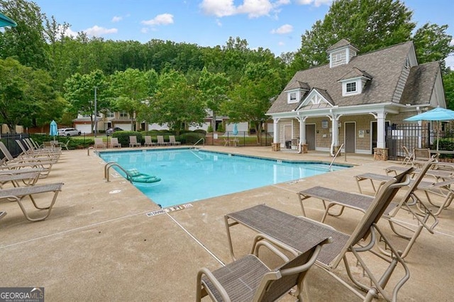 411 Mountain View Ln, Woodstock, GA 30188 - community pool featuring a patio area