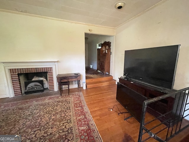 2742 Forest Ridge Dr, Macon, GA 31204 - living area with crown molding, wood finished floors, and a brick fireplace