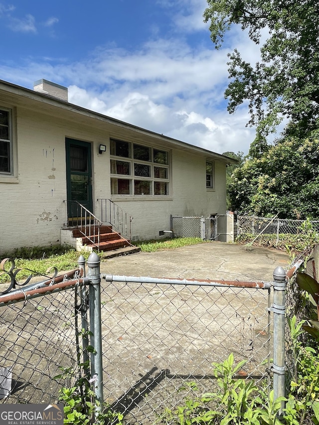 2742 Forest Ridge Dr, Macon, GA 31204 - back of property with a gate and brick siding