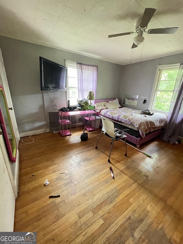 2742 Forest Ridge Dr, Macon, GA 31204 - bedroom featuring multiple windows, hardwood / wood-style flooring, and a ceiling fan
