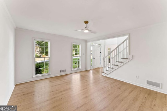3878 Brookside Pkwy, Decatur, GA 30034 - foyer entrance featuring light wood finished floors, baseboards, a ceiling fan, stairway, and ornamental molding