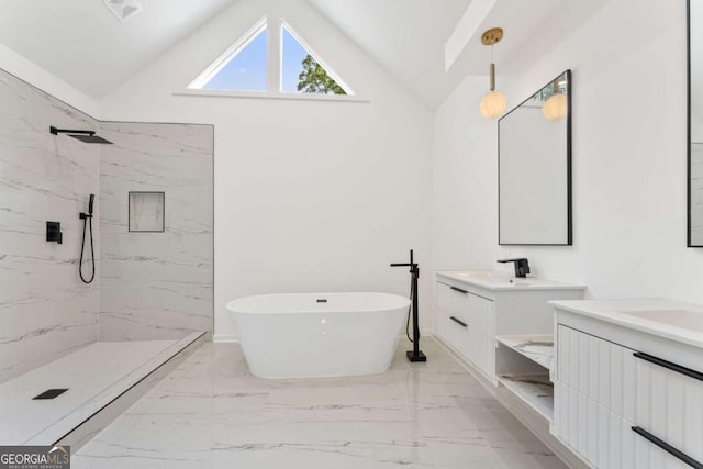 3878 Brookside Pkwy, Decatur, GA 30034 - full bath featuring marble finish floors, two vanities, a marble finish shower, a soaking tub, and high vaulted ceiling