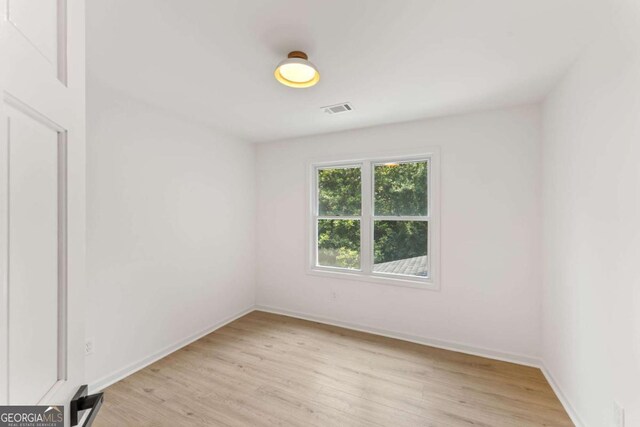 3878 Brookside Pkwy, Decatur, GA 30034 - spare room with light wood-style floors and baseboards