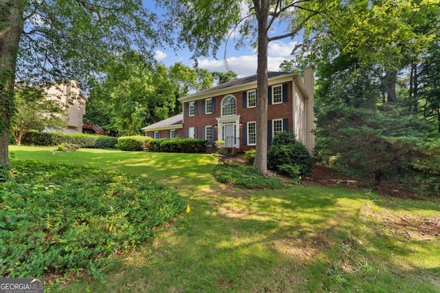 3878 Brookside Pkwy, Decatur, GA 30034 - view of front of property featuring a chimney, a front lawn, and brick siding