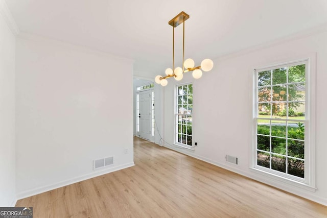 3878 Brookside Pkwy, Decatur, GA 30034 - empty room featuring ornamental molding, light wood-style flooring, a chandelier, healthy amount of natural light, and baseboards