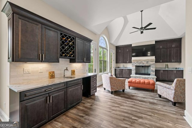 7519 Waterview Cv, Douglasville, GA 30135 - kitchen featuring a sink, ceiling fan, dark wood-style flooring, open floor plan, and decorative backsplash