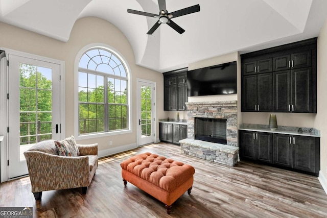 7519 Waterview Cv, Douglasville, GA 30135 - living area with healthy amount of natural light, wood finished floors, baseboards, a ceiling fan, and lofted ceiling