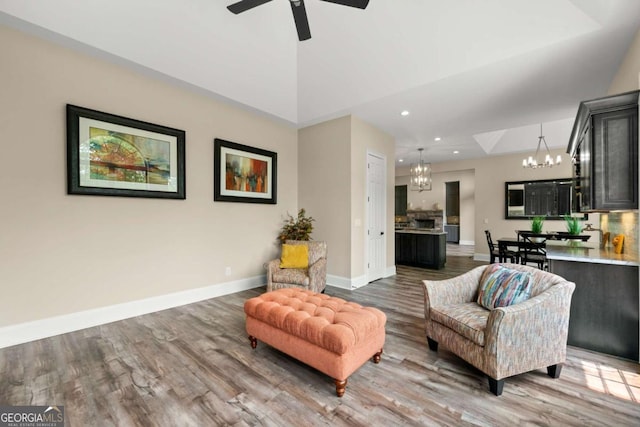 7519 Waterview Cv, Douglasville, GA 30135 - living room featuring a chandelier, wood finished floors, recessed lighting, baseboards, and a ceiling fan