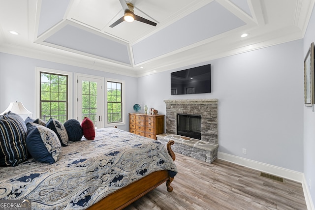 7519 Waterview Cv, Douglasville, GA 30135 - bedroom with wood finished floors, a fireplace, ornamental molding, baseboards, and a ceiling fan