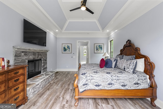 7519 Waterview Cv, Douglasville, GA 30135 - bedroom featuring crown molding, wood finished floors, a fireplace, baseboards, and a raised ceiling