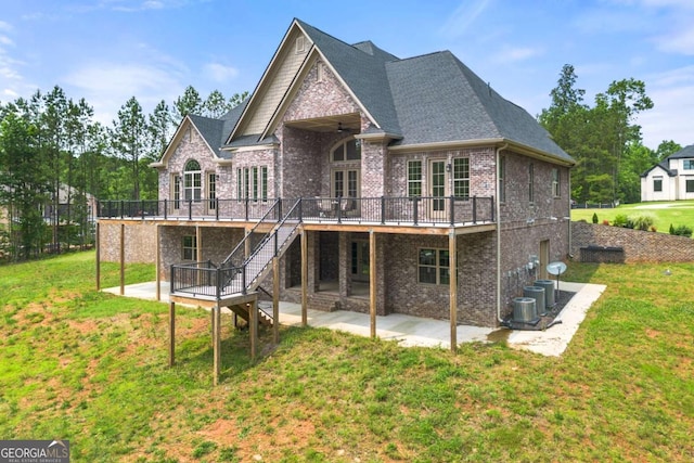7519 Waterview Cv, Douglasville, GA 30135 - rear view of house with brick siding, a deck, a patio, a lawn, and stairway