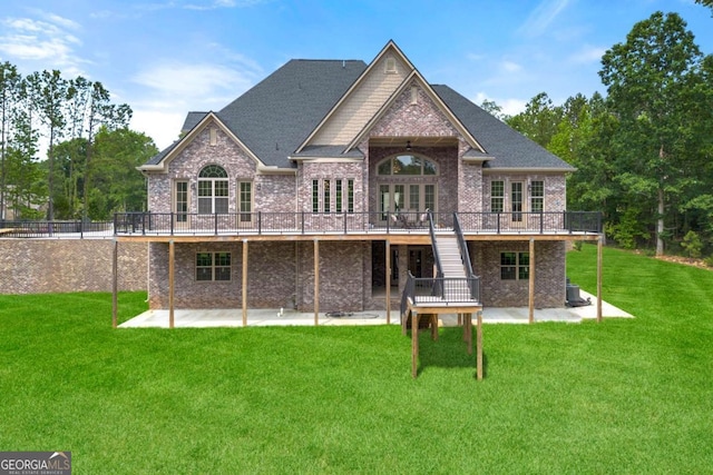 7519 Waterview Cv, Douglasville, GA 30135 - back of house with a patio, a wooden deck, brick siding, and a yard