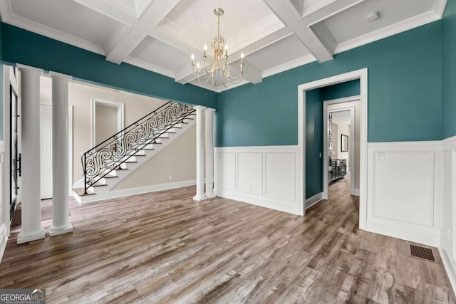 7519 Waterview Cv, Douglasville, GA 30135 - unfurnished room featuring coffered ceiling, beam ceiling, wood finished floors, a chandelier, and stairway