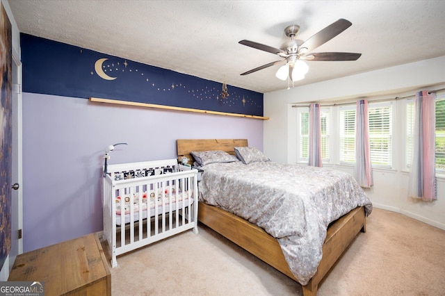 609 Hearth Pl, Lawrenceville, GA 30043 - bedroom with carpet floors, baseboards, and a ceiling fan