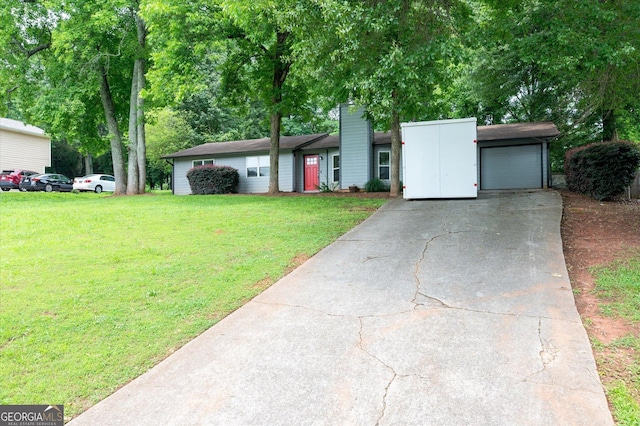 609 Hearth Pl, Lawrenceville, GA 30043 - view of front of house with concrete driveway, a front yard, and an attached garage