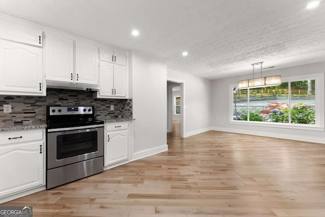 4690 Giddon Martin Rd, Gainesville, GA 30506 - kitchen with stainless steel electric stove, under cabinet range hood, white cabinetry, recessed lighting, and a textured ceiling