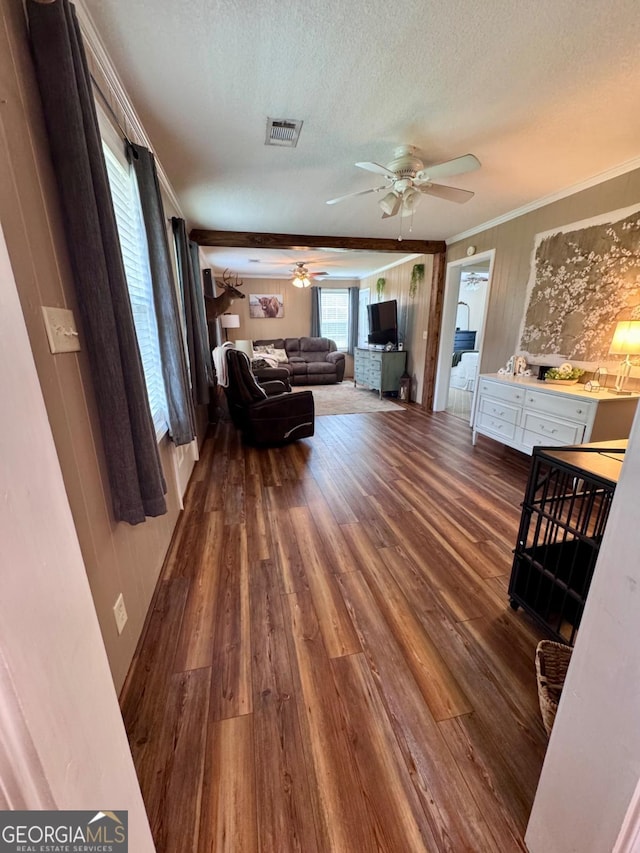 309 Ralph Wommack Rd, Hazlehurst, GA 31539 - living room with ceiling fan, wood finished floors, ornamental molding, and a textured ceiling