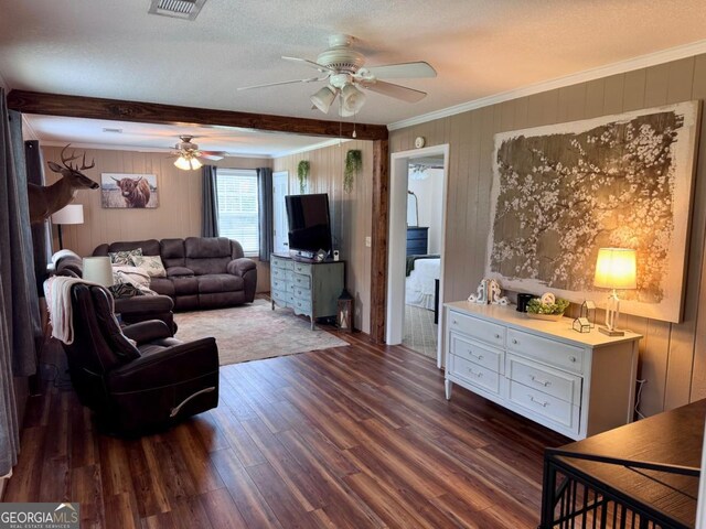 309 Ralph Wommack Rd, Hazlehurst, GA 31539 - living room with ceiling fan, wood finished floors, crown molding, and wooden walls