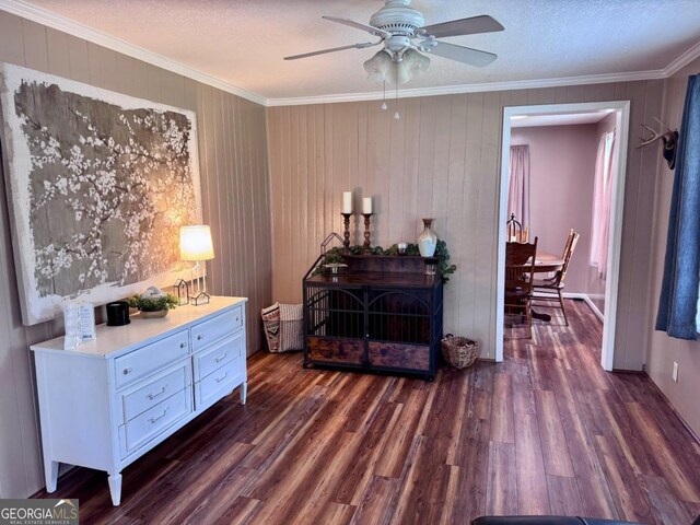 309 Ralph Wommack Rd, Hazlehurst, GA 31539 - sitting room with ornamental molding, a ceiling fan, and wood finished floors
