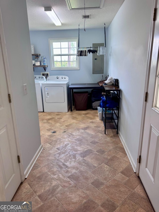 309 Ralph Wommack Rd, Hazlehurst, GA 31539 - washroom with independent washer and dryer, electric panel, stone finish floors, and baseboards