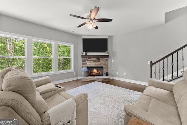 79 Brynbrooke Ct, Dawsonville, GA 30534 - living area featuring baseboards, ceiling fan, stairs, a stone fireplace, and wood finished floors