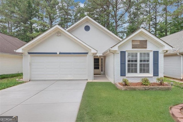 713 Fairfield Dr, Peachtree City, GA 30269 - ranch-style home featuring an attached garage, concrete driveway, a front yard, and brick siding
