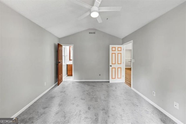 713 Fairfield Dr, Peachtree City, GA 30269 - unfurnished bedroom featuring vaulted ceiling, baseboards, carpet, and ceiling fan