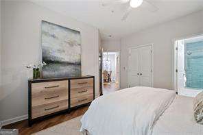 821 Ralph Mcgill Blvd NE Unit 2219, Atlanta, GA 30306 - bedroom with dark wood-style floors, ceiling fan, connected bathroom, and baseboards