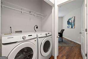 821 Ralph Mcgill Blvd NE Unit 2219, Atlanta, GA 30306 - washroom featuring independent washer and dryer, dark wood-style flooring, and baseboards