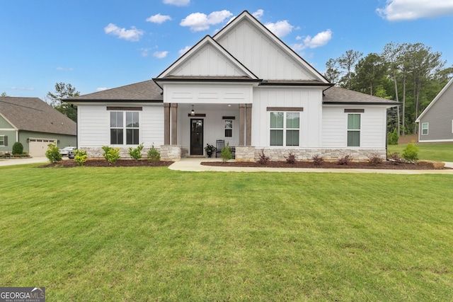 155 Lapis Lake Pt, Fayetteville, GA 30215 - modern inspired farmhouse featuring board and batten siding, a front yard, stone siding, and a shingled roof
