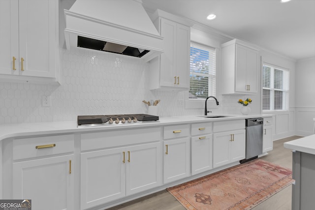 155 Lapis Lake Pt, Fayetteville, GA 30215 - kitchen featuring custom range hood, dishwasher, white cabinetry, gas cooktop, and a sink