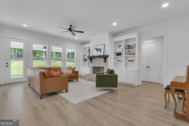 155 Lapis Lake Pt, Fayetteville, GA 30215 - living area with a ceiling fan, light wood-style flooring, a fireplace, recessed lighting, and crown molding