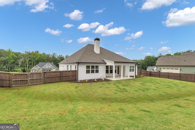 155 Lapis Lake Pt, Fayetteville, GA 30215 - back of property featuring a patio area, a chimney, and roof with shingles