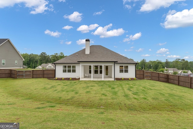 155 Lapis Lake Pt, Fayetteville, GA 30215 - back of property featuring a patio area, a chimney, and a shingled roof
