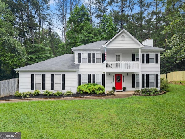 239 Hidden Ct, Winder, GA 30680 - view of front of home with a balcony, a chimney, and a shingled roof