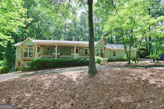 3320 Bryant Ln, Marietta, GA 30066 - single story home featuring covered porch, a chimney, and stone siding
