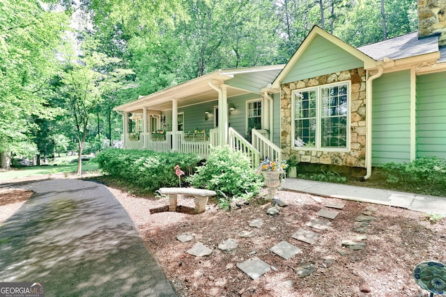 3320 Bryant Ln, Marietta, GA 30066 - single story home featuring a porch, stone siding, and a chimney