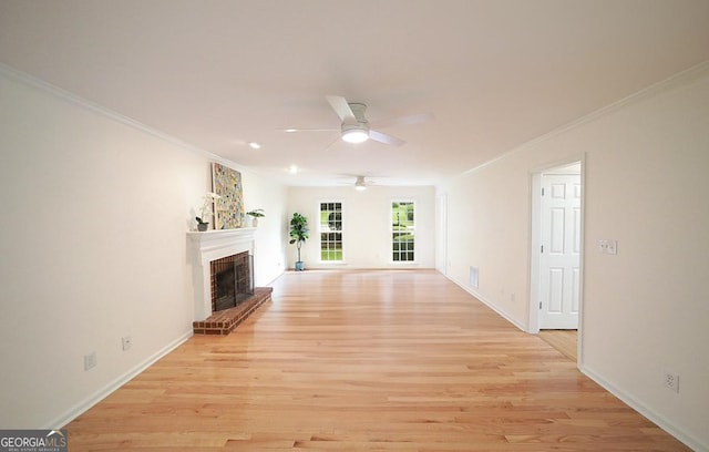 1111 Creekshore Dr, Athens, GA 30606 - unfurnished living room featuring a fireplace, light wood finished floors, a ceiling fan, crown molding, and baseboards
